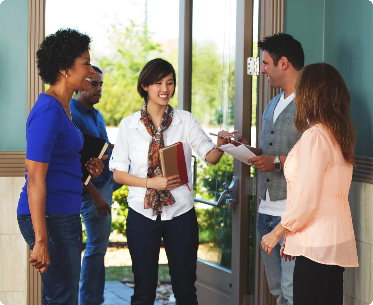 Greeters welcoming guests at the church door