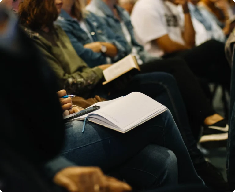 An open Bible resting on a lap during a small group